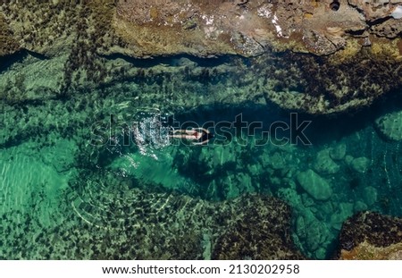 underwater swimming in a secret rock pool 