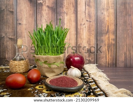 Festive table in honor of Navruz. Wheat with a red ribbon, the traditional holiday of the vernal equinox Nawruz.