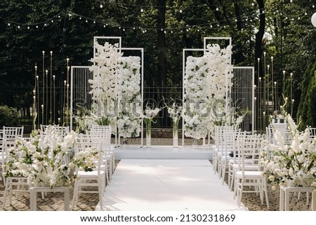 A place for a wedding ceremony on the street. Decorated wedding venue. Royalty-Free Stock Photo #2130231869
