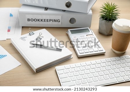 Bookkeeper's workplace with folders and documents on table Royalty-Free Stock Photo #2130243293