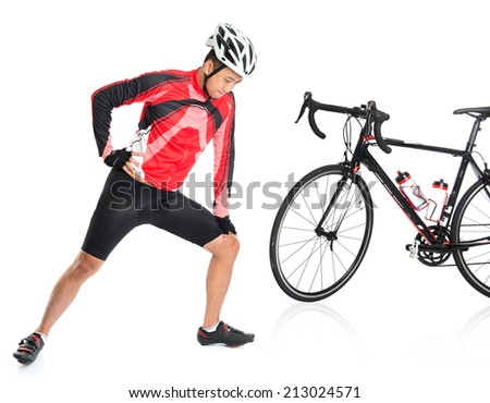 Asian biker warming up or cool down, standing beside bike, isolated on white background.