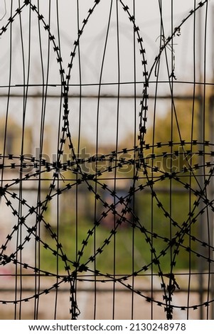 Barbed wire. The concept of a prison and a closed territory. The Iron Curtain. Breaking up the relationship. End of negotiations. Forbidden zone. Do not enter. No entrance. Embargoes and sanctions.