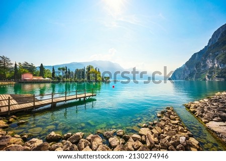 Wooden pier on the lake. Riva del Garda, Trentino, Italy, Europe.