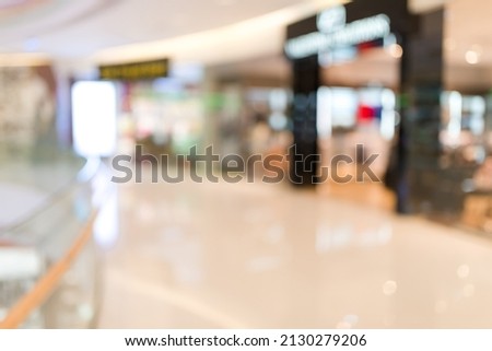 Internal of luxury shopping center with bokeh lights blur background,use for backdrop or web design.