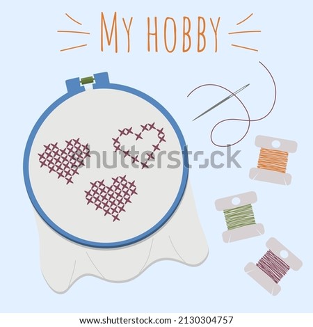 Cross-stitch. Hearts are embroidered on the canvas. Hobby. Handmade work