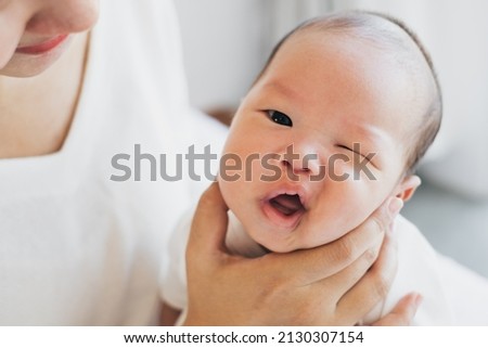 Asian Baby face funny with mother