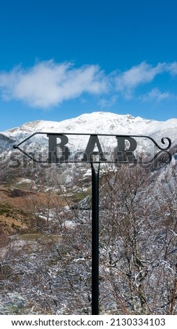 "BAR" signpost in snowy mountain