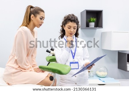 Treatment of cervical disease. Female gynecologist unrecognizable woman patient in gynecological chair during gynecological check up. Gynecologist examines a woman. Diagnostic, medical service. Royalty-Free Stock Photo #2130366131