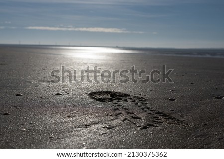 Picture of a footstep in the sand