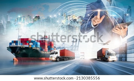 Businessman touching virtual screen world map of Global logistics network distribution, Container cargo freight ship at industrial port for logistics Import export background, Smart technology concept Royalty-Free Stock Photo #2130385556