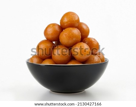 Gulab Jamun an Indian and pakistani sweet made during festivals and celebrations. Royalty-Free Stock Photo #2130427166