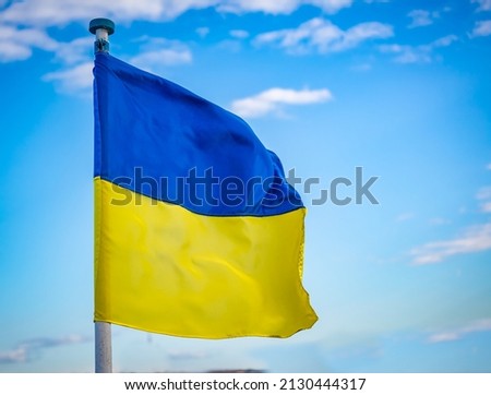 Ukrainian flag blowing from a flag pole