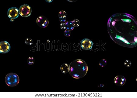 Soap bubbles isolated on a black background. Copy space. 
