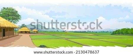 A view of a peaceful village. Large farmlands in the middle of a large landscape. Village houses with rice and paddy fields. Royalty-Free Stock Photo #2130478637