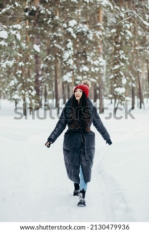 winter photo session of a girl in the forest