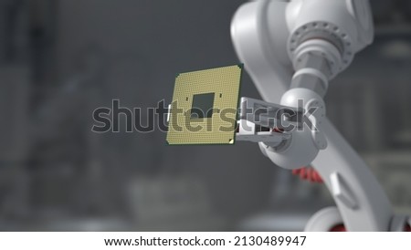 The robot holds a productive processor for a personal computer. Blurry gray background. The concept of future technologies . semiconductors Royalty-Free Stock Photo #2130489947