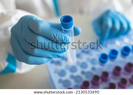 Process of coronavirus PCR antigen testing examination by nurse medic in laboratory lab, COVID-19 swab collection kit, test tube for taking OP NP patient specimen sample, patient receiving a test