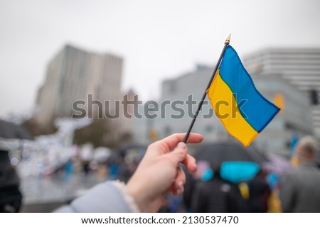 Ukrainian flag on the background of the rally. No war. Support for Ukraine Royalty-Free Stock Photo #2130537470