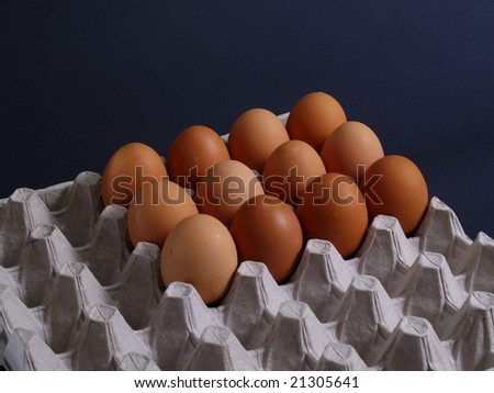 Fresh Eggs In Egg Carton Isolated On Black