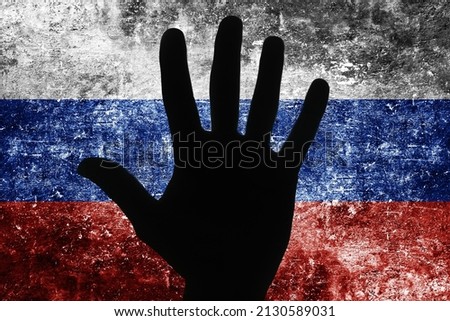 Stop the war background. Open hand in gesture of protest. Russian Federation flag. Flag of Russia. Grunge industrial war background. Dirty flag texture. White, blue and red color country symbol. 