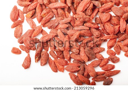 pile of dried goji berry on white background