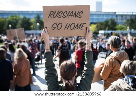 Protest against Russian invasion of Ukraine. People holding anti war sings and banners in street.