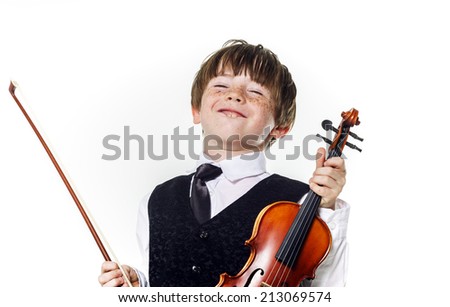 Red-haired preschooler boy with violin, music education Royalty-Free Stock Photo #213069574