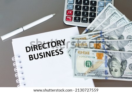 Text in the notebook DIRECTORY BUSINESS on office desk, business concept