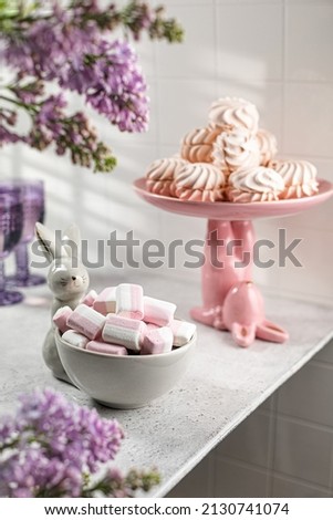 easter dishes with marshmallows and lilac spring rabbit  plate