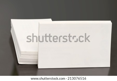 blank business cards on a black background