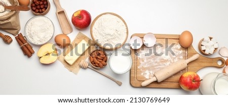 Ingredients for pie or cake cooking on light table Royalty-Free Stock Photo #2130769649