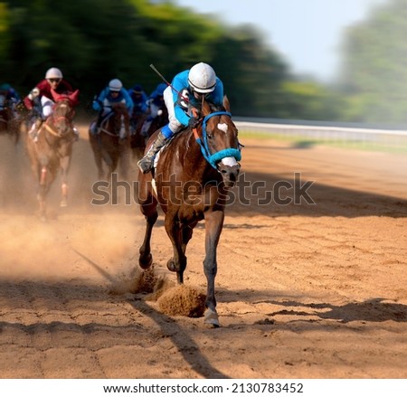 Galloping race horses in racing competition. Jockey on racing horse. Sport. Champion. Hippodrome. Equestrian. Derby. Speed Royalty-Free Stock Photo #2130783452