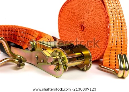 Ratchet straps to control load loading. Cargo securing belt. Close-up on a white background Royalty-Free Stock Photo #2130809123