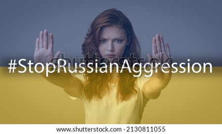 Angry Teenage Girl Gesturing Stop Sign Showing Two Palms Asking To Stop Russian Aggression With Hashtag Warning, Forbidding Invasion Standing On Blue And Yellow Ukrainian Flag Studio Background