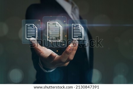 Businesswoman extending her hand to online document file information in technology electronics document management paperless office E-signing business contract concept