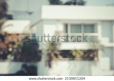The Blurred image of homes, buildings, apartments and bokeh from the melting of the len 
used. for scene background or wallpaper and design work.