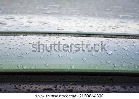 Raindrops on the roof of the car