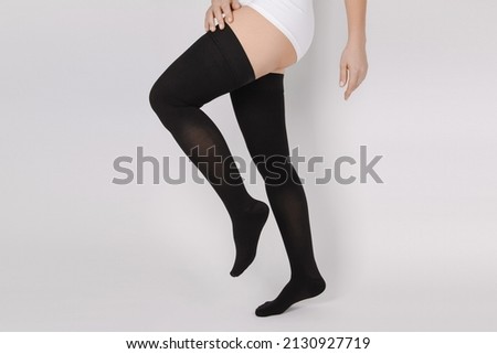 Compression Hosiery. Medical Compression stockings and tights for varicose veins and venouse therapy. Socks for man and women. Clinical compression knits. Comfort maternity tights for pregnant women. Royalty-Free Stock Photo #2130927719