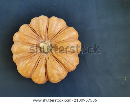 Raw organic pumpkin with yellow color after harvest get ready for vegetarian food