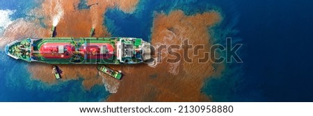 Oil leak from Ship , Oil spill pollution polluted water surface. water pollution as a result of human activities. industrial chemical contamination. oil spill at sea. petroleum products. Royalty-Free Stock Photo #2130958880
