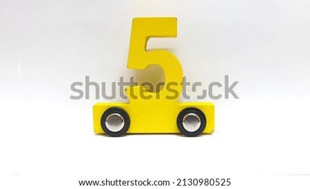 train made of wood with wheels. children toys. close up. isolated. educational purpose. colorful numbers.