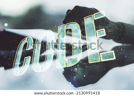 Creative Code word sign and finger clicks on a digital tablet on background, international software development concept. Multiexposure