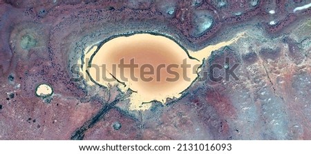 abstract landscape of the deserts of Africa from the air emulating the shapes and colors of the polluted lakes