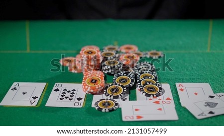 Gamer person playing poker in casino. Betting chips stacks. Call and raise. Card game on green table. Gambling. Texas Hold'em. Dealer and gambler, fortune. Royalty-Free Stock Photo #2131057499