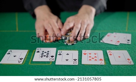 Gamer person playing poker in casino. Betting chips stacks. Call and raise. Card game on green table. Gambling. Texas Hold'em. Dealer and gambler, fortune. Royalty-Free Stock Photo #2131057805