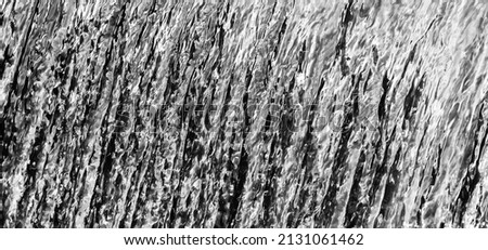 Abstract horizontal black and white photograph of an beautiful waterfall. Great for commercial use, backgrounds and wallpapers