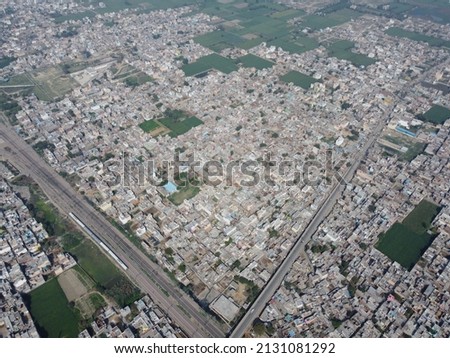 Aerial view of houses and buildings in a city 