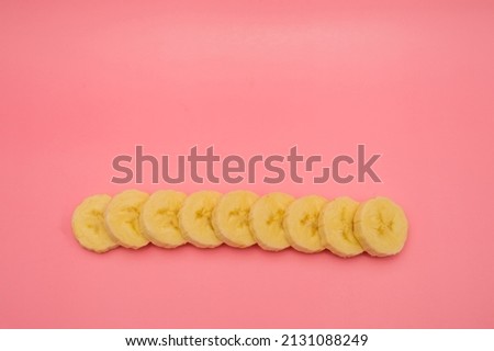 banana slices on a pink background for captions and inscriptions