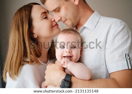 a happy family with a newborn baby. mom, dad and baby. psychological assistance to young parents. products and cosmetics for the whole family. foster family and adoption of children. Royalty-Free Stock Photo #2131135148