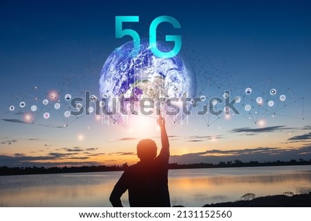 Silhouette man standing with circle network communication technology for 5G.Data in the global computer social.telecommunication,earth.photo modern technology and communication concept.